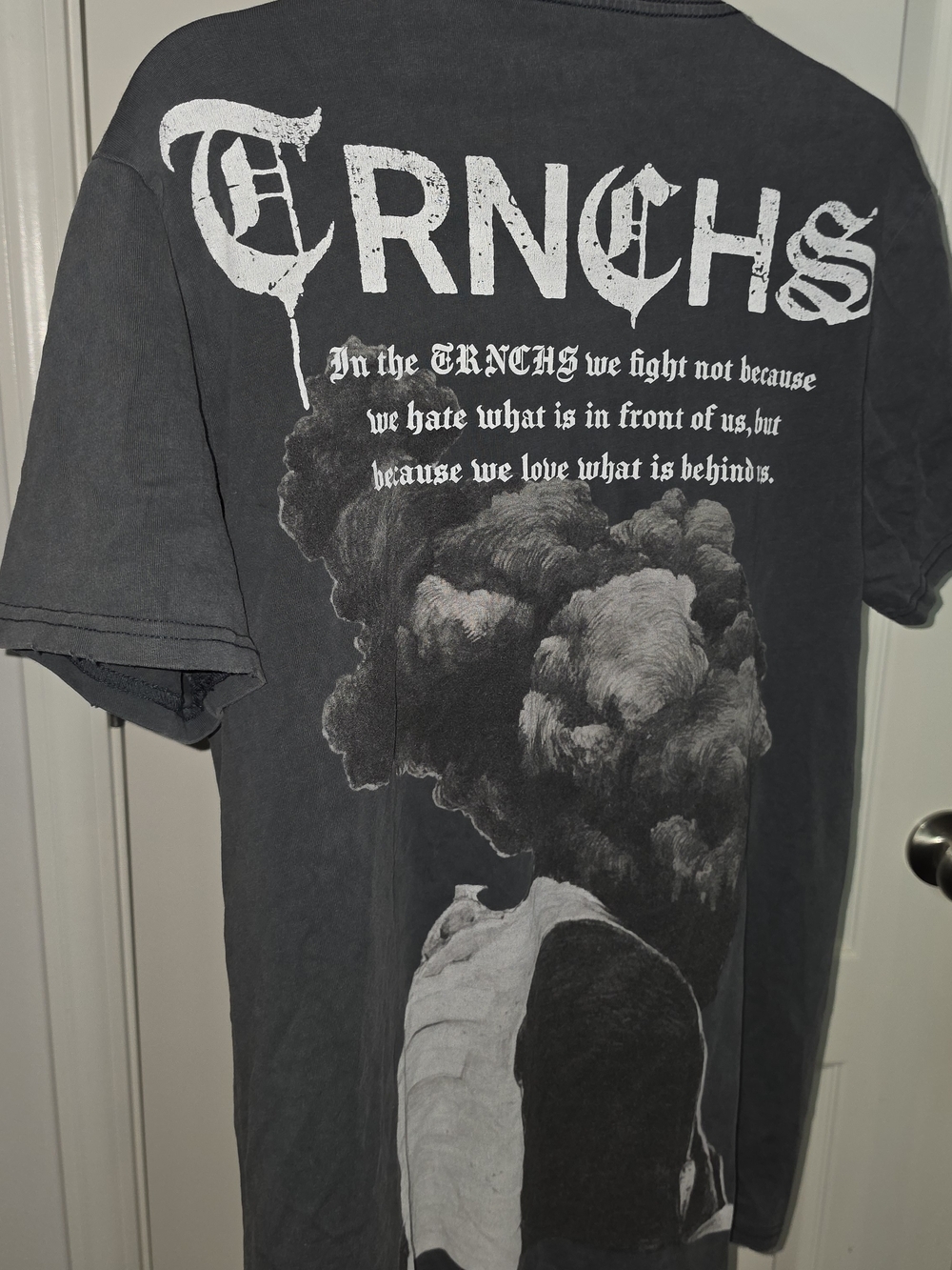 The Trnchs cotton t-shirt with white graphic of a person with smoke Text